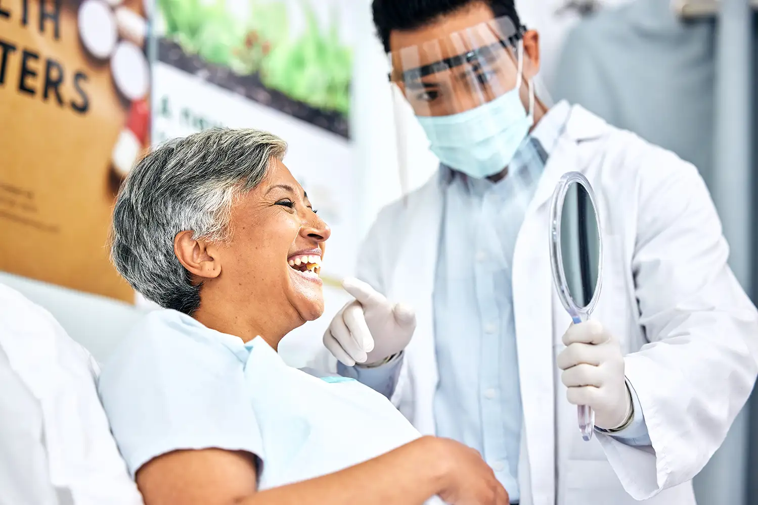 woman receiving a consultation about her teeth from an oral surgeon