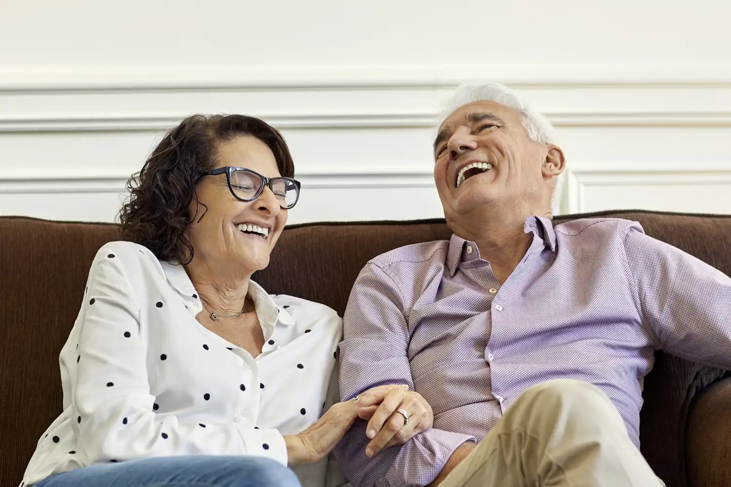Cheerful senior couple at home